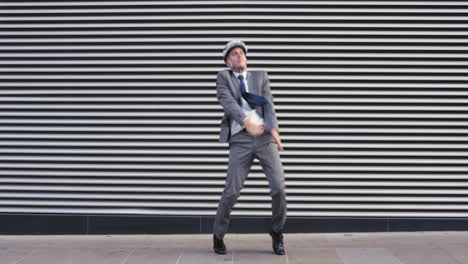 contemporary funky caucasian businessman street dancer dancing freestyle in the city