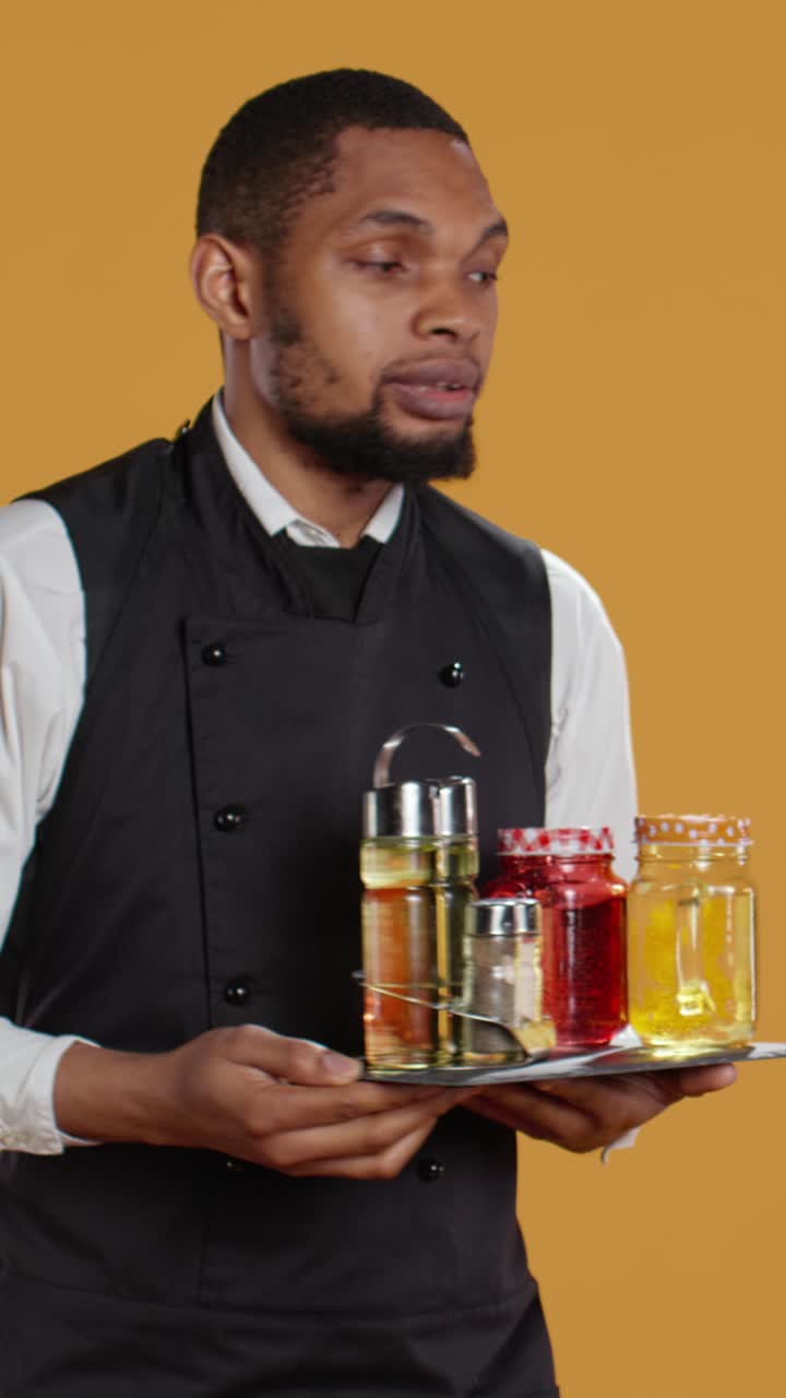 Professional Waiter Holding Tray with Condiments and Drinks