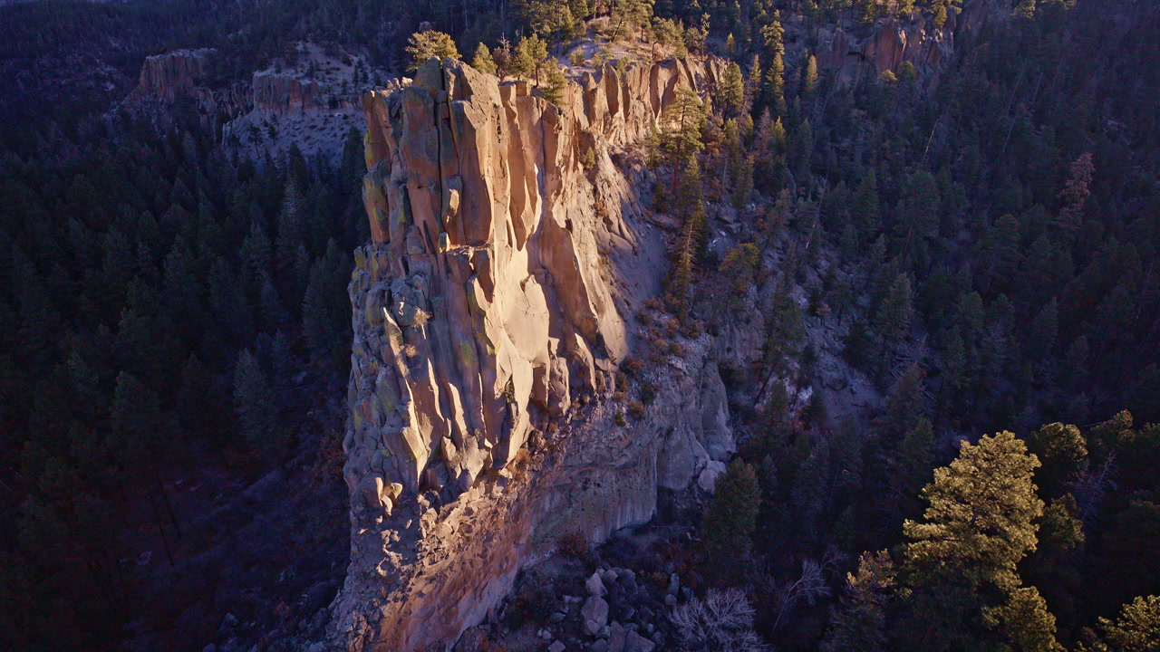 Drone shot of expansive canyon terrain and rugged cliffs near Los Alamos