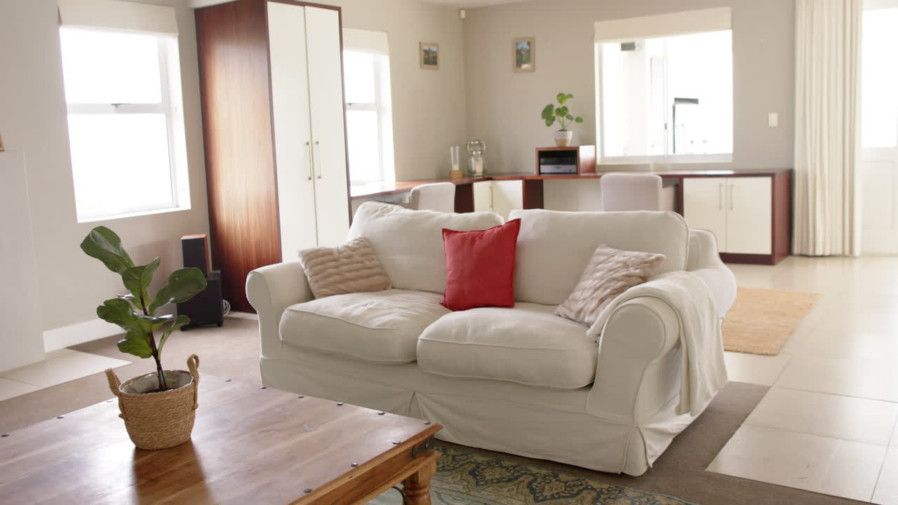 General view of light modern interiors with sitting room with kitchen, copy space, slow motion