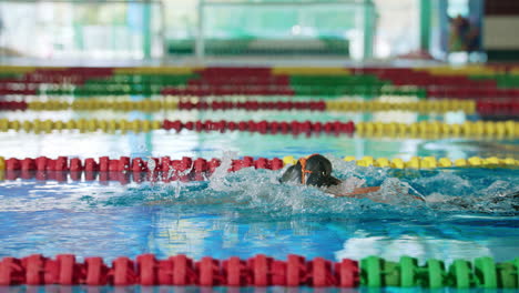 two female swimmers fighting to win a breaststroke discipline race, slow motion