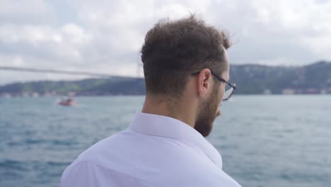 thoughtful man watching the sea.