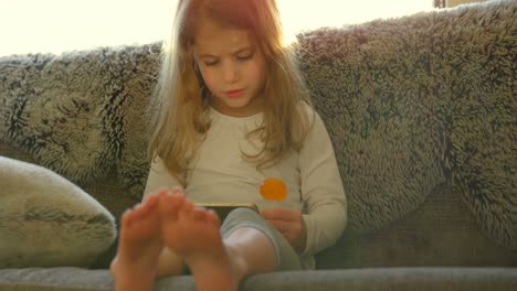 Girl-using-digital-tablet-in-living-room-4k