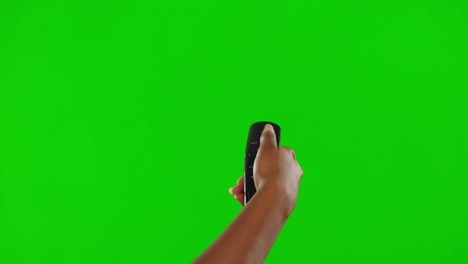 Hand,-remote-control-and-green-screen