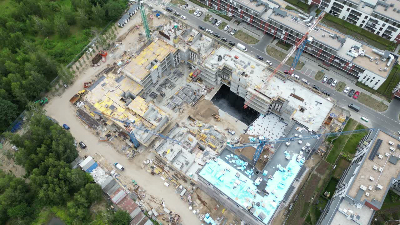 Aerial view of construction site with crane and building. Top view of big development construction and architecture