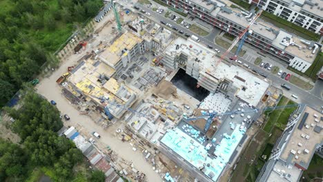 aerial view of construction site with crane and building. top view of big development construction and architecture