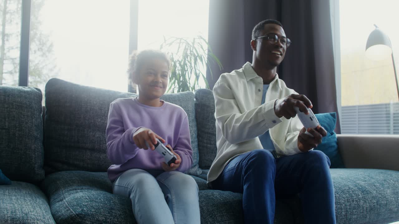 Father and Daughter Enjoying Gaming Together