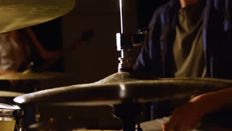 Drummer-playing-drum-in-studio