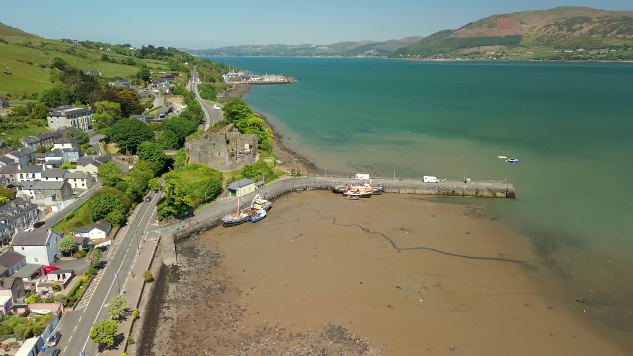 Descending aerial video of Carlingford Castle and Carlingford Lough in County Louth, Ireland on a bright and sunny day. Filmed in 4K, 60FPS and with Rec709 color.