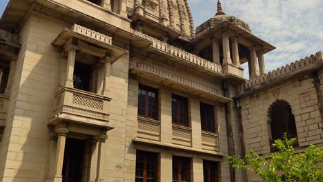 stunning 4k footage of kirti mandir in vadodara, gujarat, showcasing intricate indo-saracenic architecture beneath a vibrant sky. a cultural and historical gem of india’s royal legacy.