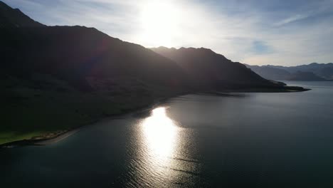 lake hawea at sunrise in south island, new zealand - aerial shot