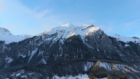 breathtaking panorama of snowy peaks in alps mountains below blue sky