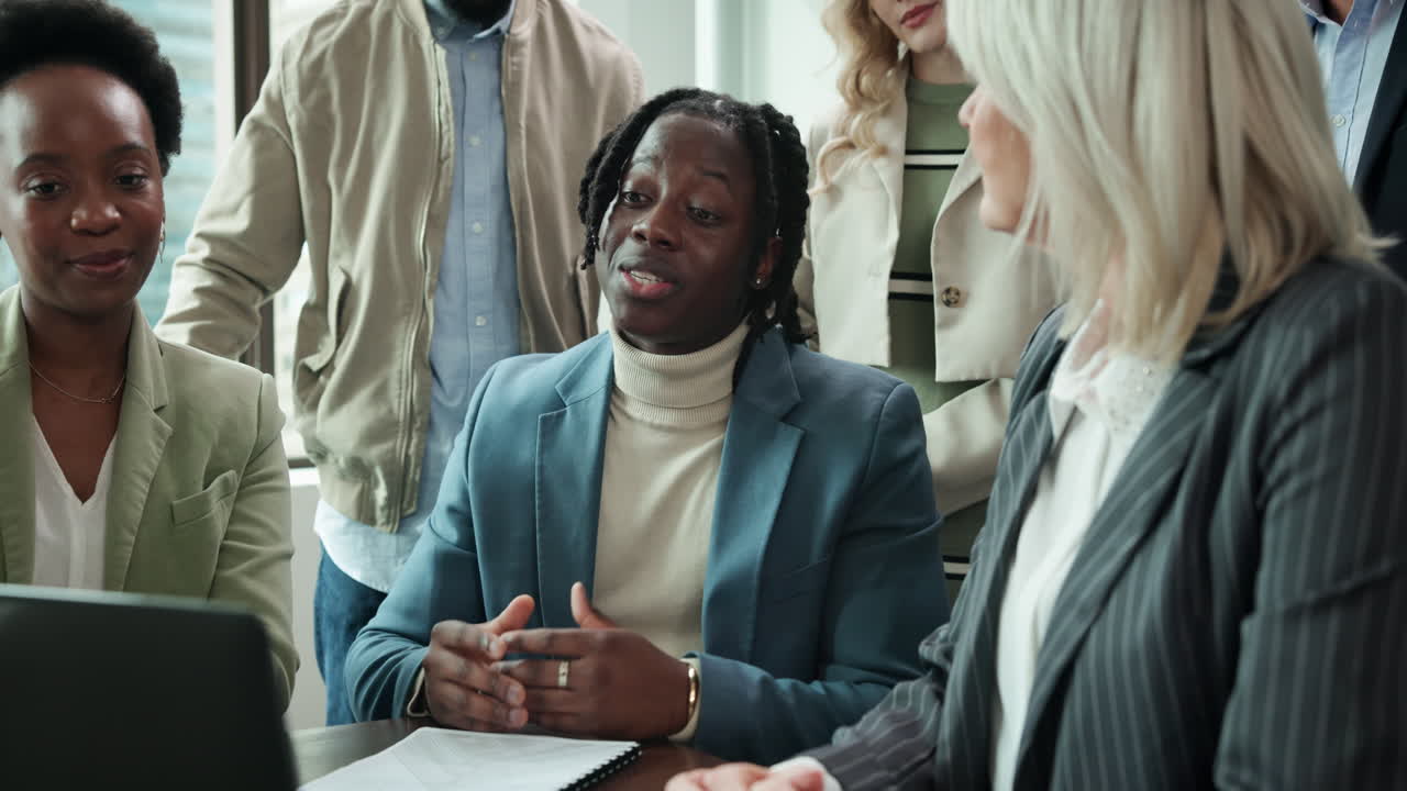 A diverse group of professionals collaborating in an office meeting