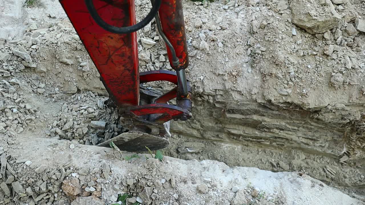 Pit dug on the ground by a small crawler excavator
