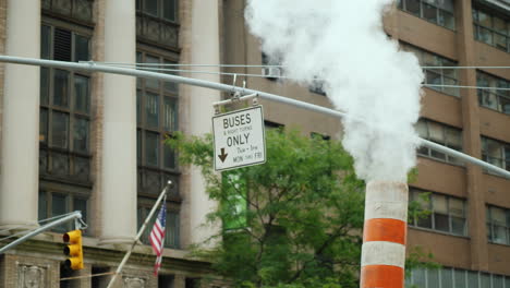 pipe with excess steam from the steam system of new york bright orange striped - one of the symbols