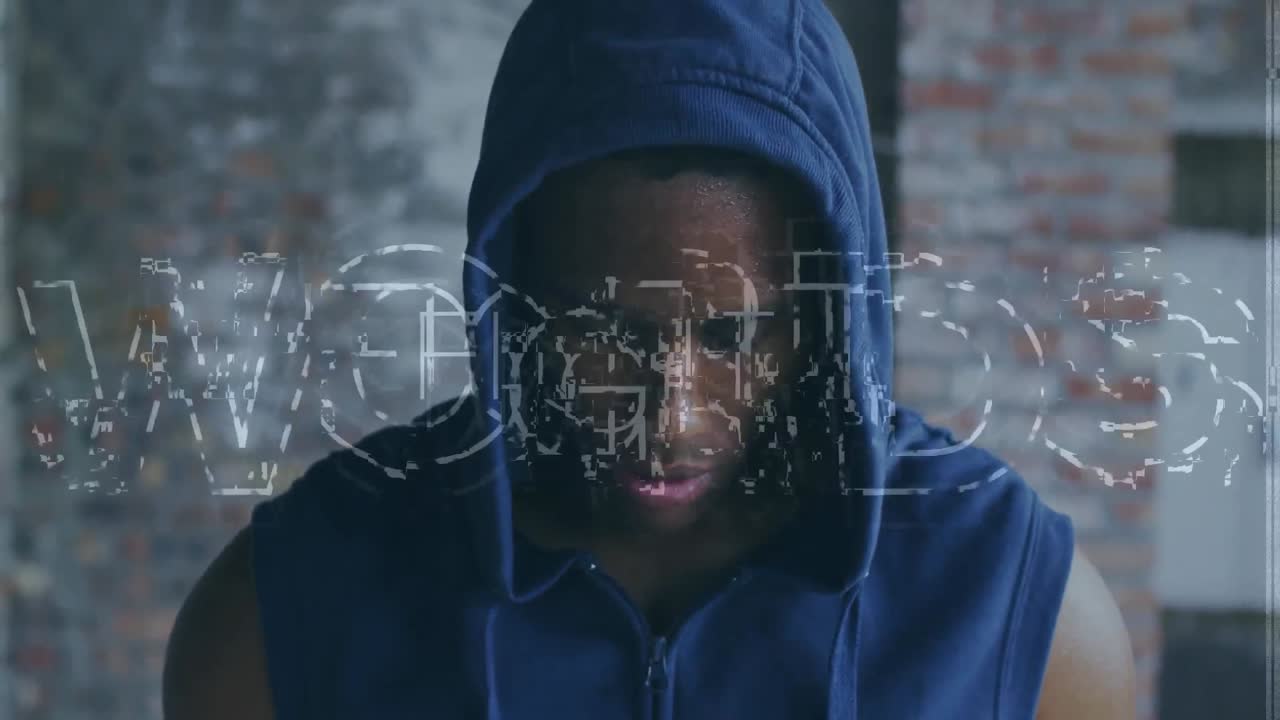 Animation of fight text over african american sportsman at gym