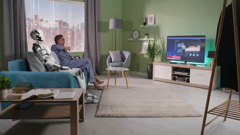 man and robot relaxing at home, watching news on tv