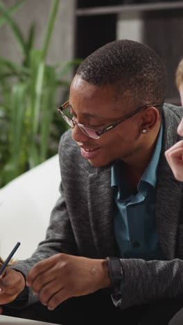 african-american man educator in glasses asks question to student and girl becomes offended at private english tuition with native speaker at home slow motion