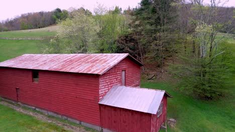 aerial pullout red barn on farm near boone nc, north carolina