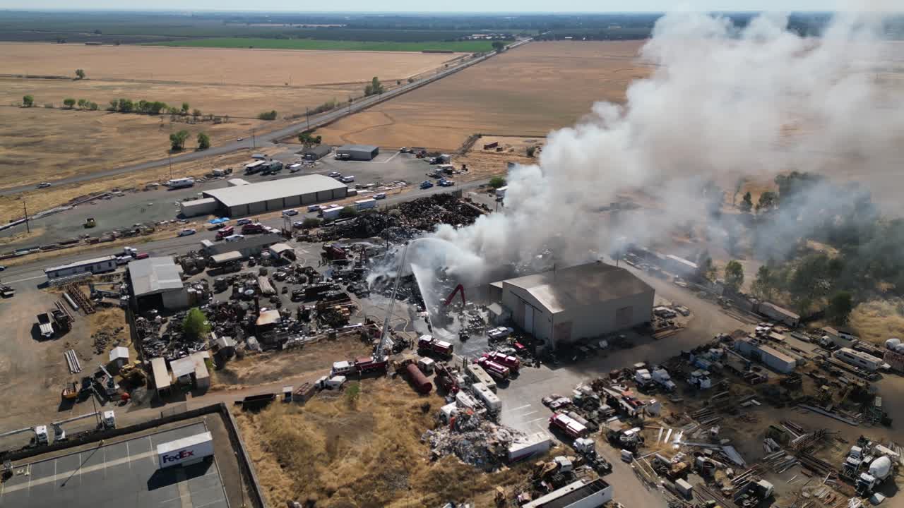 Aerial View of Large Fire at a Scrap Metal and Junkyard Facility