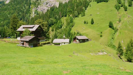 settlements downhill near mountain alps in the canton of uri, switzerland