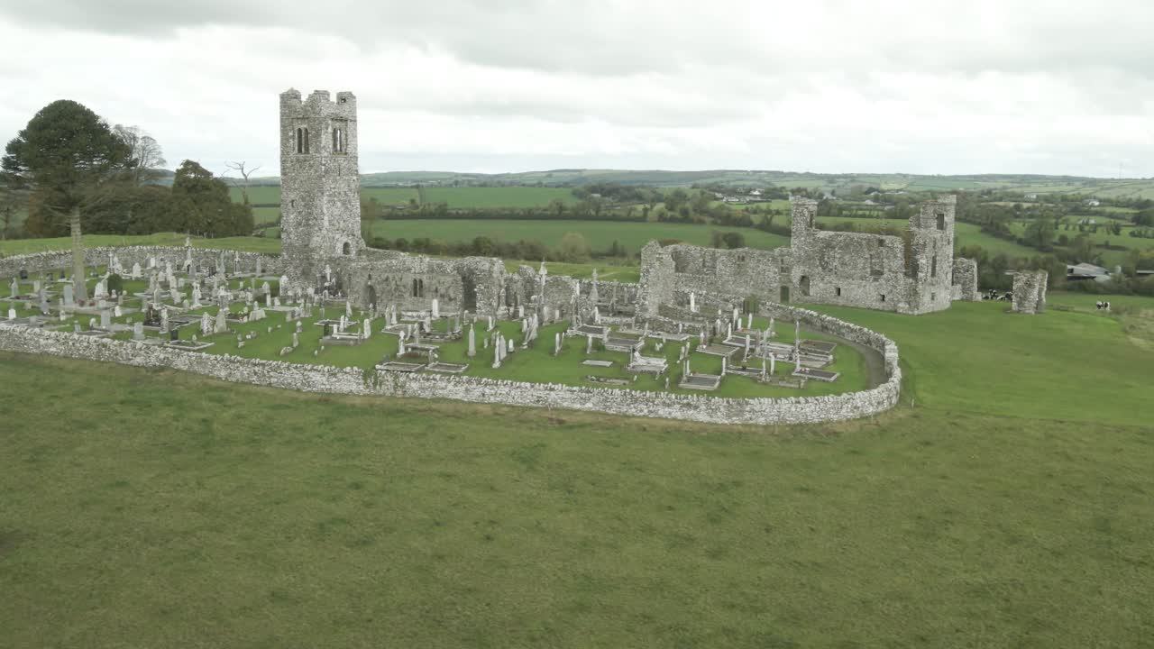 Hill of Slane ruins with a historic monastery and tower surrounded by lush green countryside