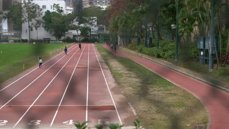 children running on a racetrack