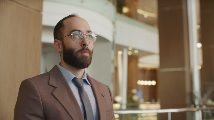 Entrepreneur Shaking Hands during Conversation with Business Partner in Hotel