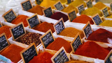 assortment of various herbs and spices being sold at a bazaar or market