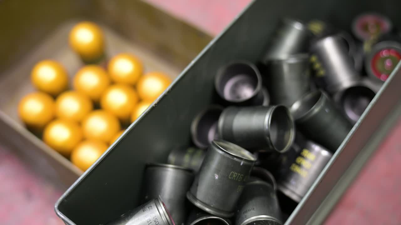 At a Ukrainian drone workshop in Donetsk, Ukraine, grenades are modified with plastic for drone deployment. Innovative weapon production for today's conflict.