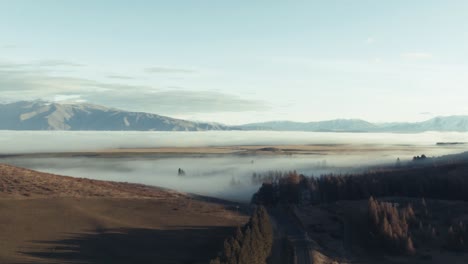 low hanging cloud covers entire plain with inversion layer