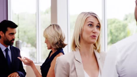 business executives interacting with each other during break