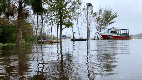 Abandoned-boats-sitting-in-parking-lot-from-hurricane-storm-flood-waters