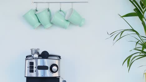 Mugs-hanging-on-hook-in-kitchen-4k