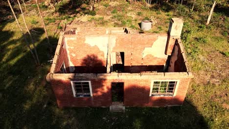 drone view of abandoned brick house ruins