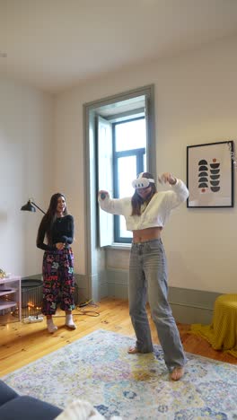 teen girls playing vr games in living room