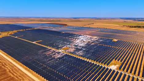 Sustainable energy production concept. Numerous solar panels installed in the field from drone footage