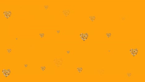 Animación-De-Corazones-De-Flores-Moviéndose-En-Movimiento-Hipnótico-Sobre-Fondo-Naranja