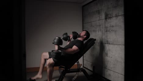 incline dumbbell chest press, cinematic lighting, white man dressed in black gym attire