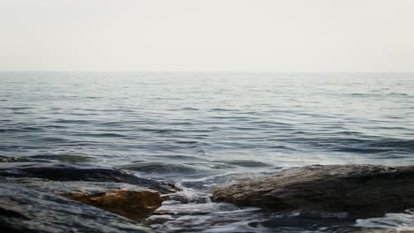 ocean waves crashing on rocks