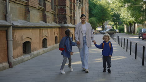 mother walking children to school