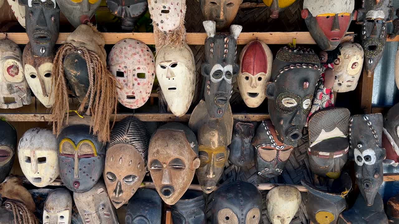 Masks for sale in a souvenir shop on a beach in Zanzibar, Tanzania.