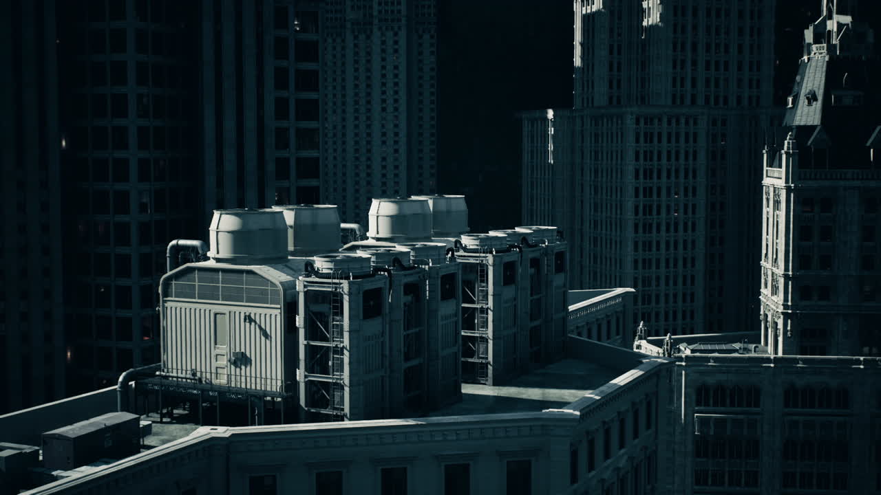 Modern cooling systems on the rooftop of a high rise building at dusk