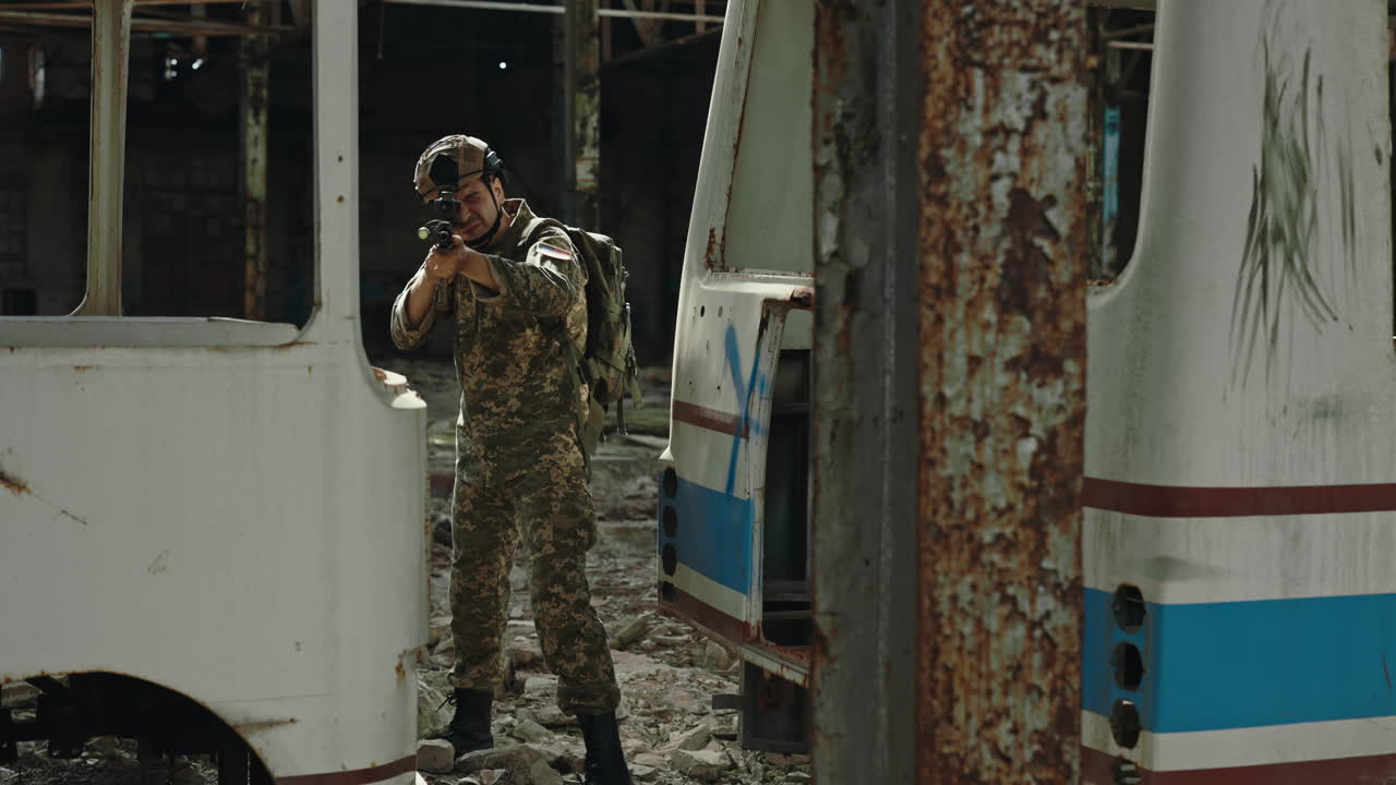 Military soldier in ruined building with weaponry