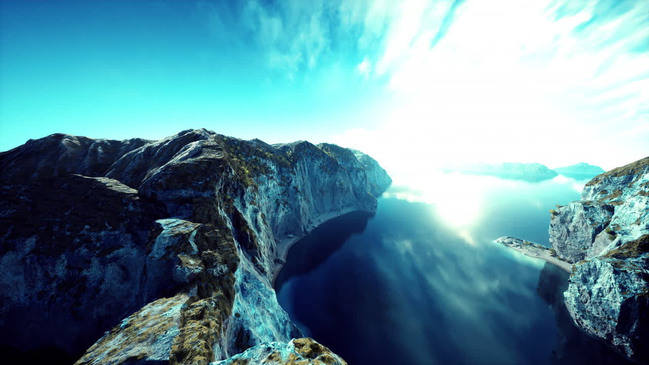 vista aérea de una majestuosa cordillera y un lago tranquilo