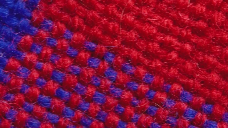 Red and blue cage clothes background macro