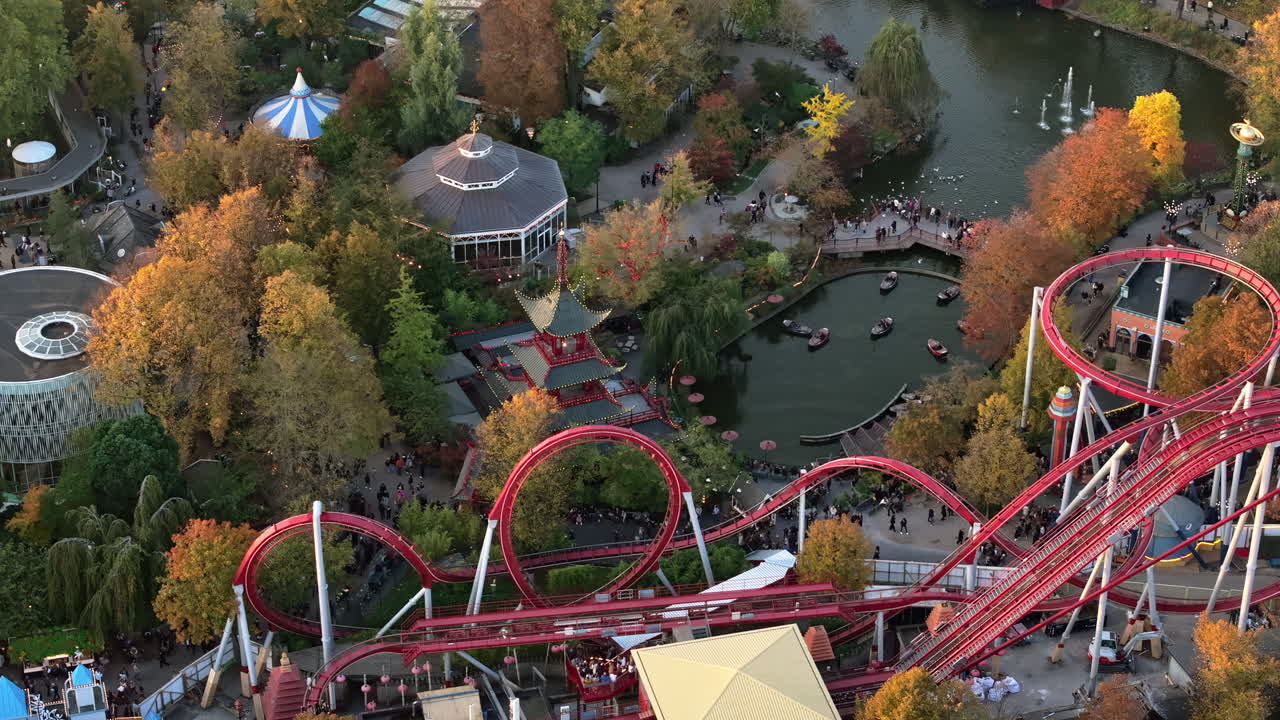 Aerial drone view of the Tivoli amusement park and the City Hall in Copenhagen, Denmark at sunset