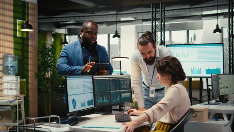 vertical video diverse employees team engaged in business planning and report writing