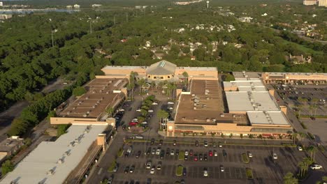 drone view flying towards the center court area of silver sands outlet mall in destin florida