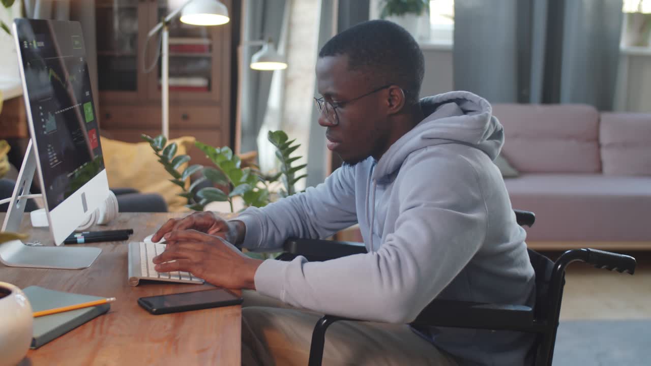 Black Man on Wheelchair Working Online from Home